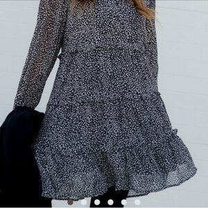 Brand new cheetah long sleeve button dress .